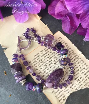 Amethyst gemstone, charoite stone, lampwork glass, silver metal, bracelet.