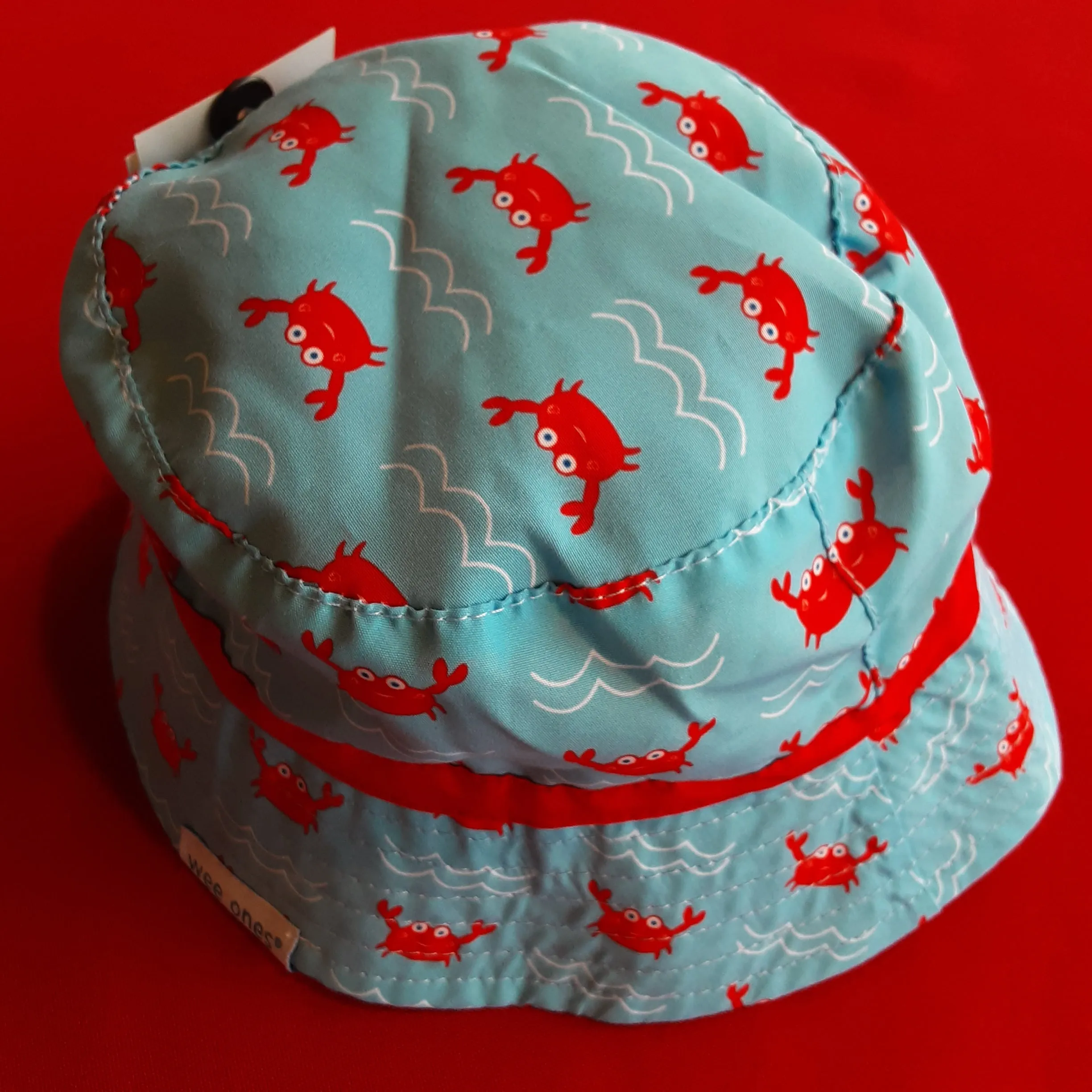 Reversible Crab Bucket Hat converts to Solid Red Bucket Hat | Wee Ones