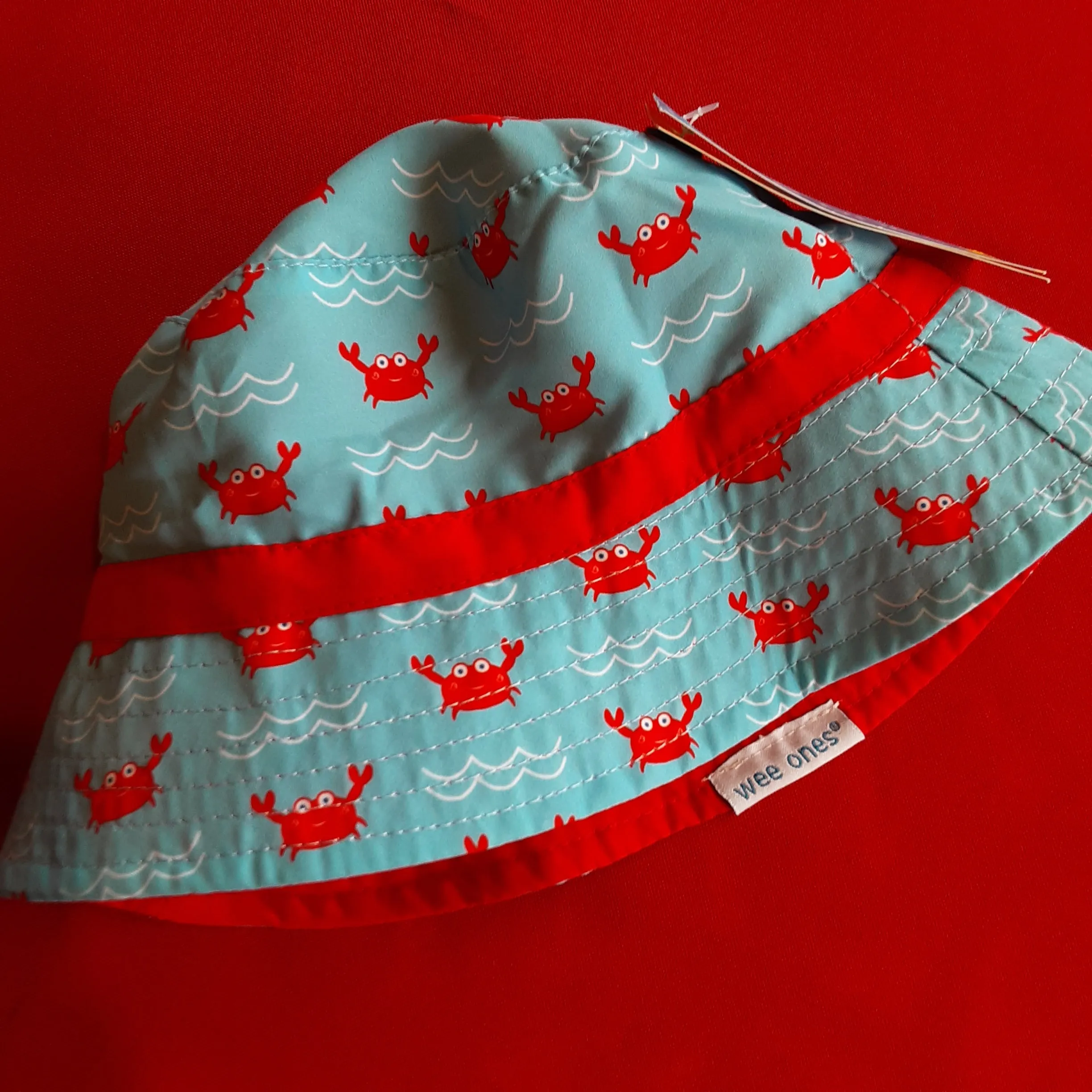 Reversible Crab Bucket Hat converts to Solid Red Bucket Hat | Wee Ones